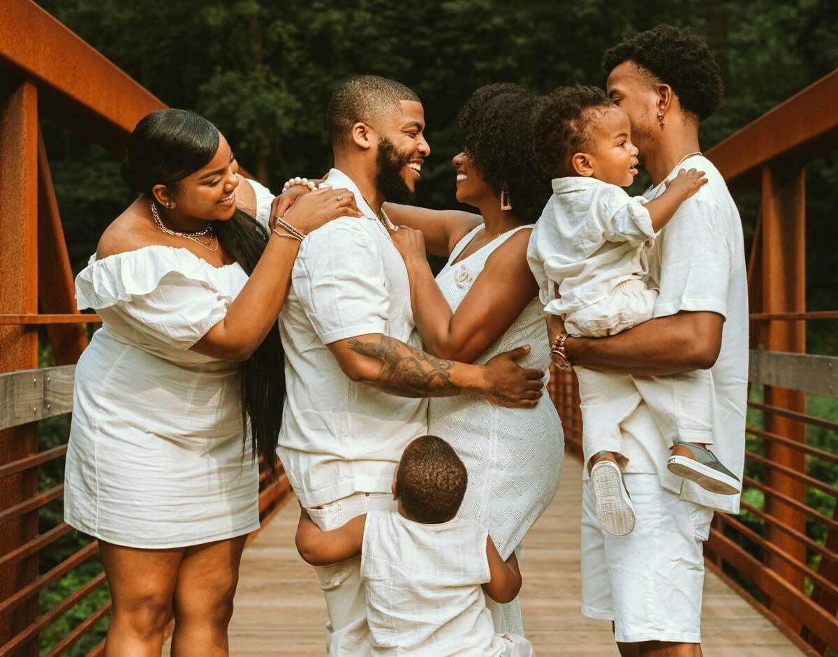 Happy family on a bridge.